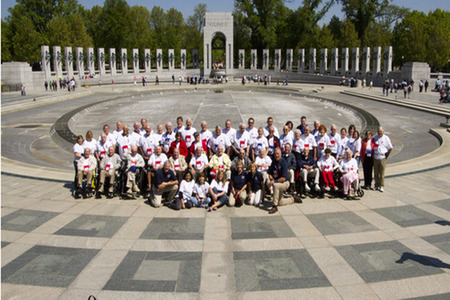 group photo of a bunch of people with white t shirts