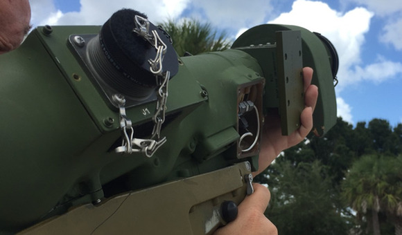 manpad being held by a man who looks to be aiming it towards the sky